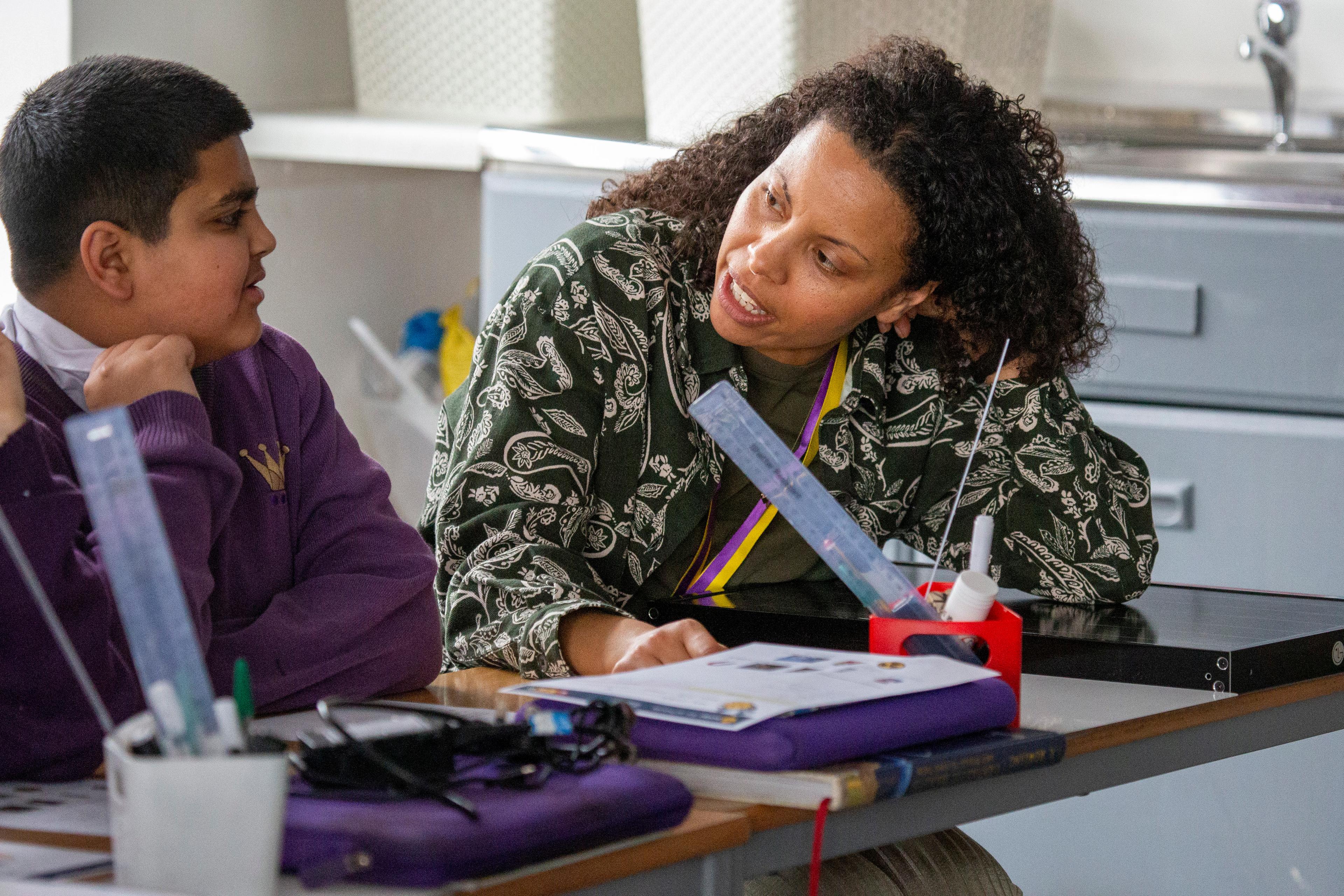 Education advisor talking with a student in a school setting
